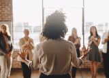 Back shot of a women addressing a group of other women