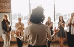 Back shot of a women addressing a group of other women