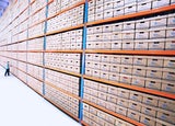 Wide shot of a wholesale warehouse with a worker in the distance