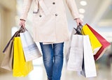 Customer carrying multiple shopping bags