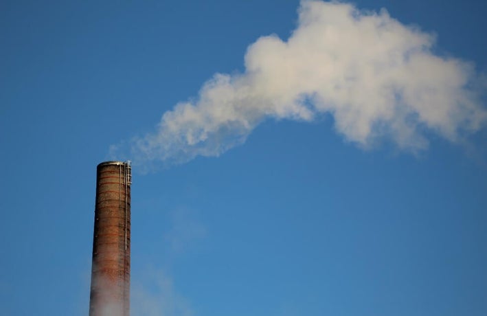 industrial pipe spewing CO2 into atmosphere